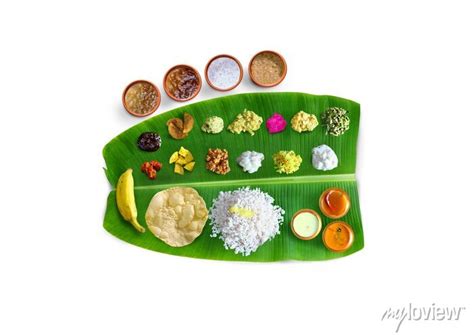 Traditional food onam sadya served on a banana leaf on festival posters ...