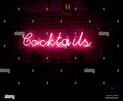 Cocktails neon sign Stock Photo - Alamy