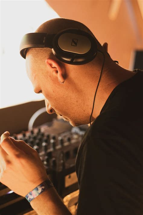 Man In Black Shirt Wearing Using Headphones · Free Stock Photo