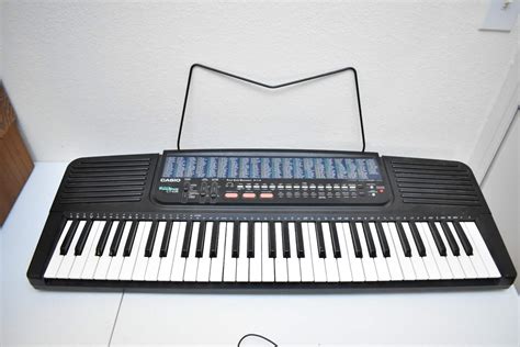 Casio Keyboard with Stand - Movin On Estate Sales