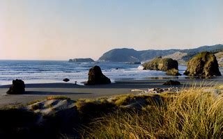 1982 13 Oregon Coast | Two tiny figures on the beach provide… | anoldent | Flickr