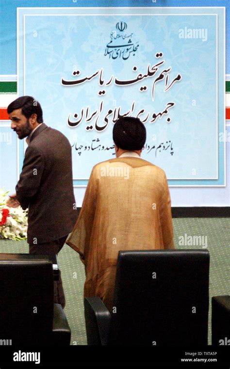 Iran's new President Mahmoud Ahmadinejad (L) walks into parliament to ...