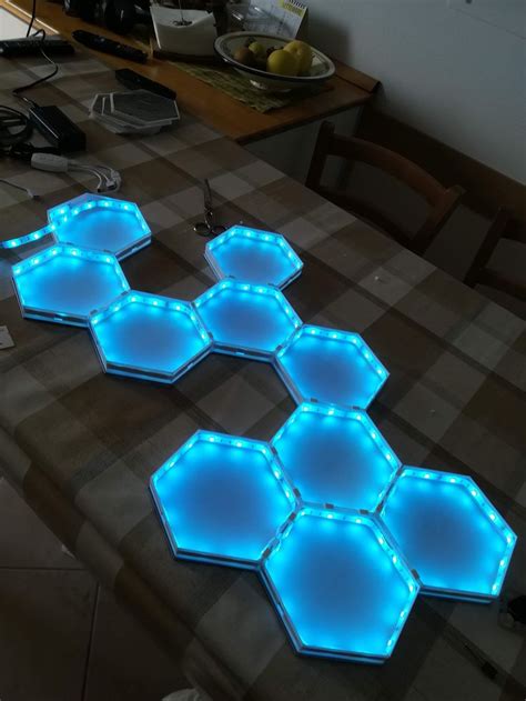 three hexagonal lights sitting on top of a table