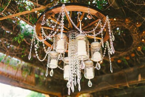 Wagon Wheel Mason Jar Chandelier | Candle chandelier diy, Mason jar chandelier, Diy chandelier