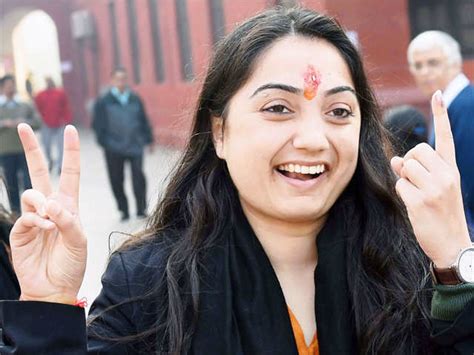 BJP candidate Nupur Sharma - Delhi Elections 2015: Casting votes to ...