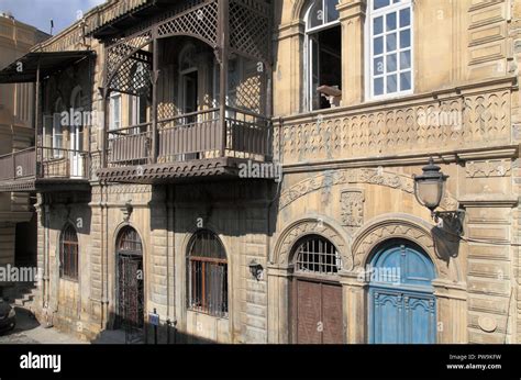 Azerbaijan; Baku, Old City, street scene, balconies, historic ...