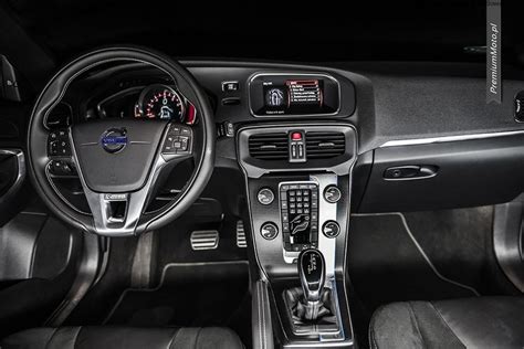 the interior of a car with black leather seats and gauges, steering ...