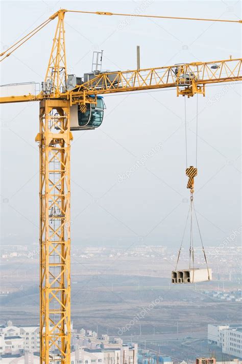 Column tower crane lifting load ⬇ Stock Photo, Image by © kalinovsky ...