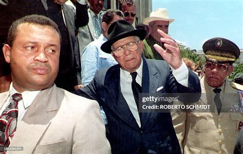 Dominican President Joaquin Balaguer waves to a crowd outside a... News ...