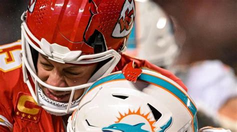 A chunk of Patrick Mahomes’ helmet went flying off after hit by Dolphins player