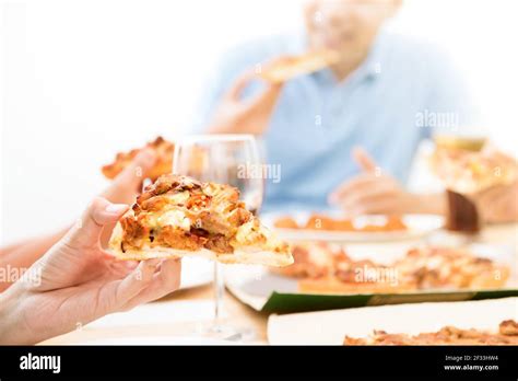 People eating pizza Stock Photo - Alamy