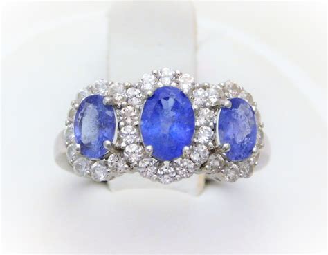 Pin by Edberg Jewelry, Inc. on Rings | White sapphire halo ring, Three stone rings, Sapphire ring