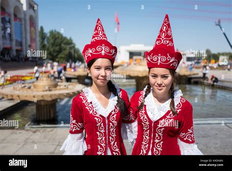 Girls in traditional dress in Bishkek, Kyrgyzstan Stock Photo ...