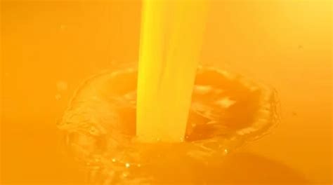 Pouring orange juice, Slow Motion | Stock Video | Pond5