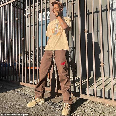 Travis Scott rocks a leopard jacket as he is seen leaving dinner past midnight in West Hollywood ...