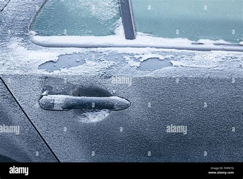 Frozen car door close-up Stock Photo - Alamy