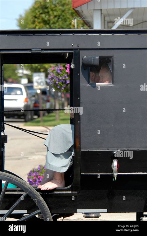 Amish people in a horse and buggy in Shipshewana Indiana Stock Photo ...