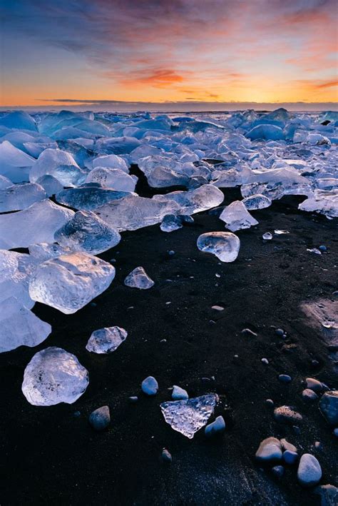 Sunrise on Jökulsárlón beach, Southern Iceland | Sunrise, Beach, Explore