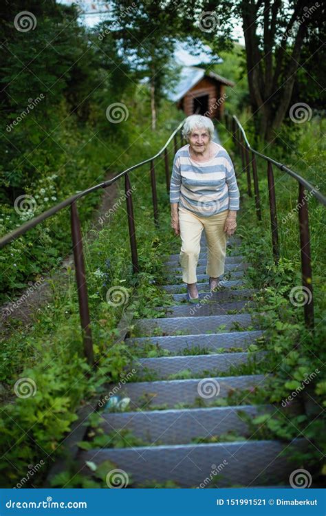 An Elderly Woman Walks in a Summer Park Stock Image - Image of lifestyle, enjoying: 151991521