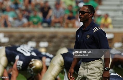 Head coach Tyrone Willingham of the Notre Dame Fighting Irish watches ...