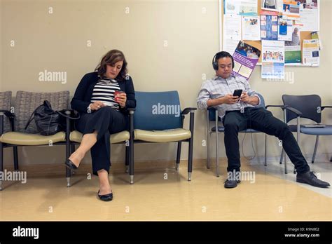 People sitting and waiting in a Hospital waiting room in Toronto ...