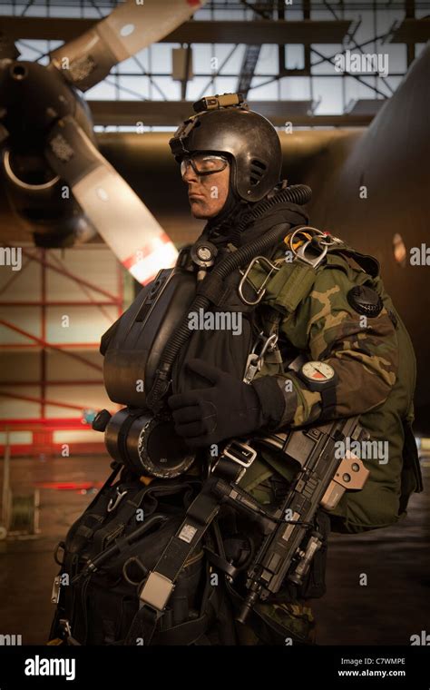 U.S. Navy Seal combat diver prepares for HALO jump operations from a C ...