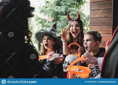 Spooky Kids in Halloween Costumes Shouting Stock Photo - Image of food ...