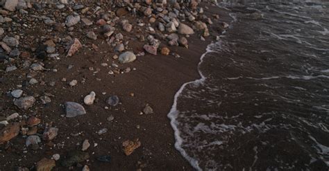 Water at Seashore with Rocks · Free Stock Photo