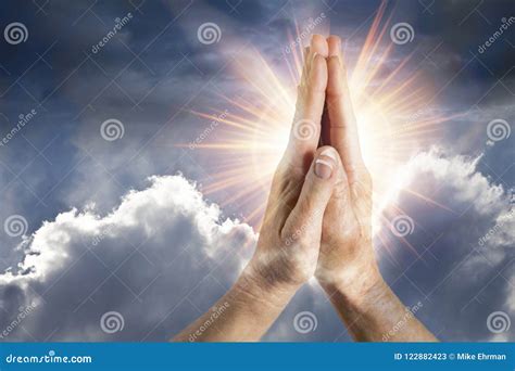 Hands in Prayer with Sun and Clouded Background Stock Image - Image of ...