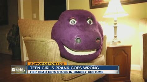 WATCH: Teen gets Barney head from costume stuck on head during failed prank - YouTube