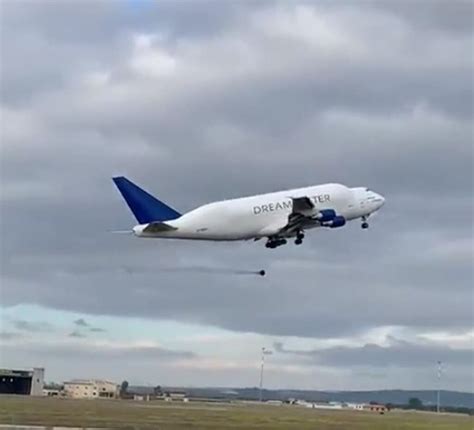 Moment a 100kg wheel falls off massive Boeing Dreamlifter jet - CHASING ...