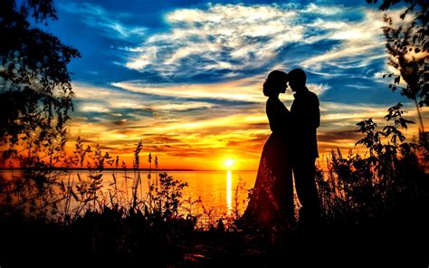 Download Couple Silhouette With Sunset Sky Romantic Background | Wallpapers.com