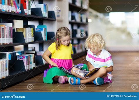 Child in School Library. Kids Reading Books Stock Image - Image of library, education: 145778109