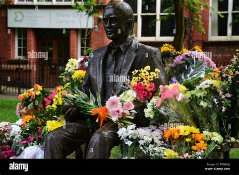 Alan Turing statue with flowers Stock Photo - Alamy