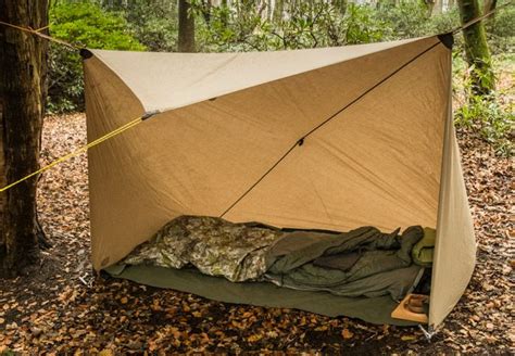 Using a 3x3m tarp this provides a cosy little shelter just about the right size for bedding and ...