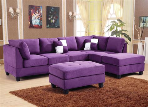 a living room with a purple couch and ottoman