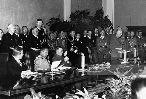 Signing of the Tripartite Pact. On the lefthand side of the picture, seated from left to right ...