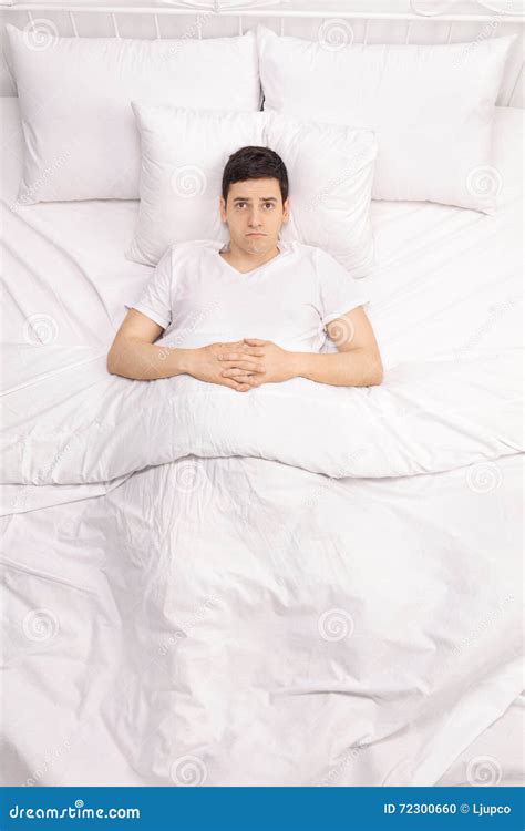 Worried Young Man Laying in Bed Stock Photo - Image of negative, person: 72300660