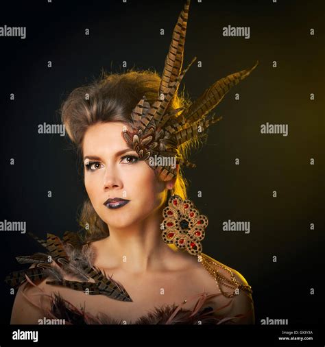 Girl harpy. Creative make-up for Halloween Stock Photo - Alamy