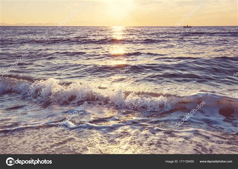 Blue wave on the beach Stock Photo by ©kamchatka 171135450