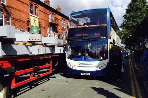 Driver 'narrowly escapes death' after lorry collides with bus on a ...