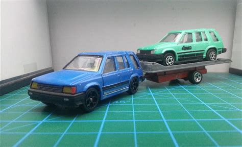 A toyota tercel, hauling a toyota tercel. : r/HotWheels