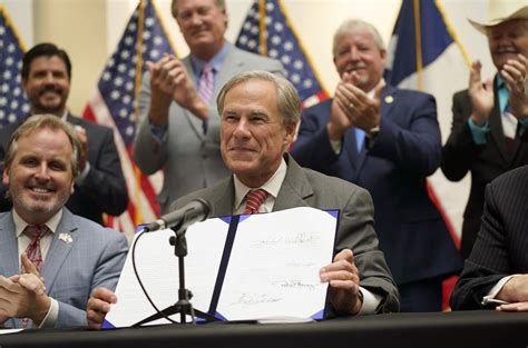 Texas governor signs new GOP voting restrictions into law | AP News