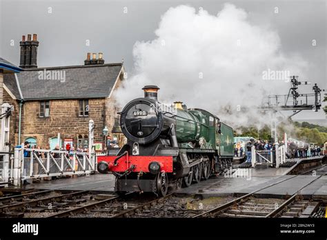 BR 'Hall' 4-6-0 No. 6990 'Witherslack Hall' runs around its train at Grosmont on the North ...