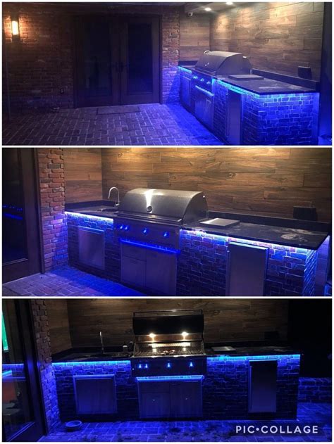 DIY rustic outdoor kitchen with Lynx grill, brushed granite countertop, and LED lighting for ...