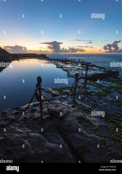 Morning sunrise across the Bogey Hole - Newcastle NSW Australia. This convict dug ocean pool ...