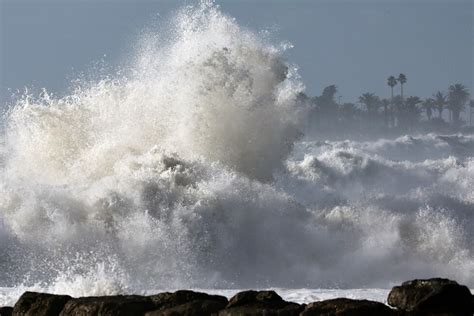 Surf's up: Big waves pound the West Coast as forecasters issue warnings