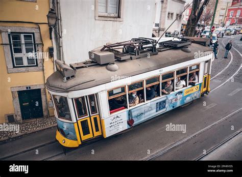 Old tram through the streets of beautiful Lisbon Stock Photo - Alamy