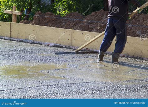 Worker Leveling Fresh Concrete Slab with a Special Working Tool Stock Photo - Image of building ...