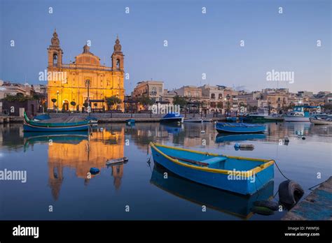 Dawn at Msida Yacht Marina, Malta. Msida parish church Stock Photo - Alamy